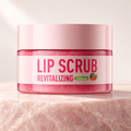 Watermelon lip scrub jar on pale rose stone