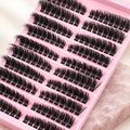 3D cluster false lashes, ten rows on a pink tray, on pale rose stone