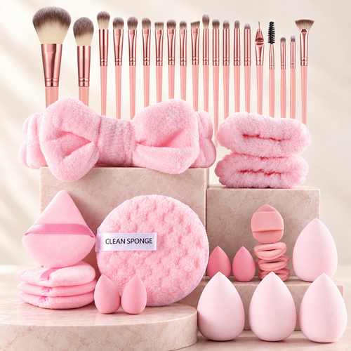 46 piece pink makeup set: brushes, sponges, puffs, headband and scrunchies on pale rose stone