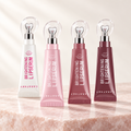 Brightening lip serum, four shades with heart shaped applicators, on pale rose stone